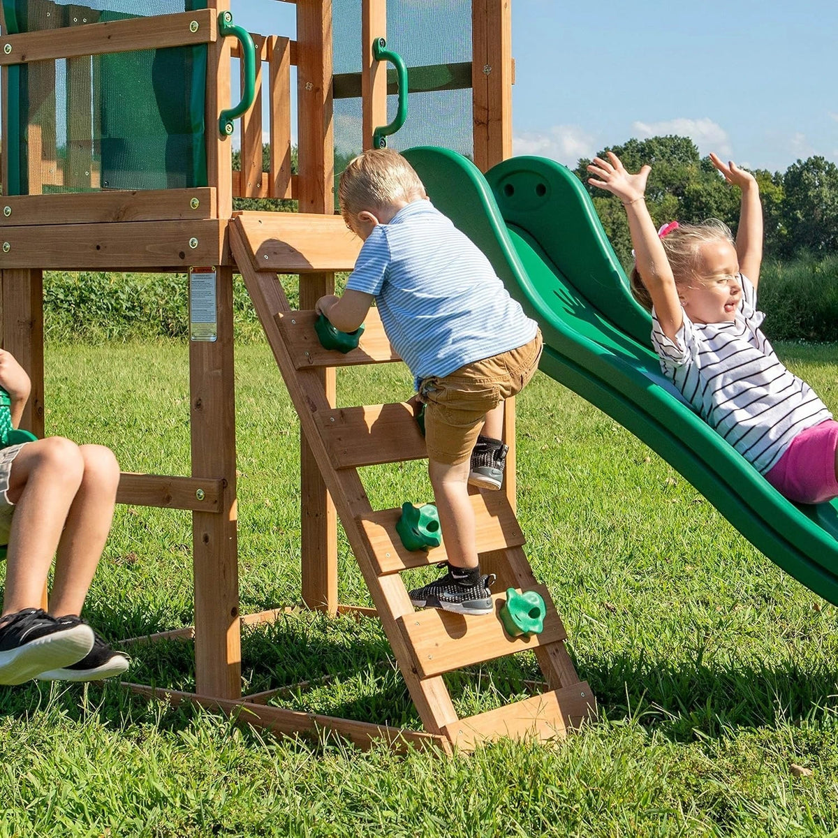 Backyard Discovery Buckley Hill Cedar Wood Swing Set with Wave Slide, Play Deck, Rock Wall Ladder, Belt Swings, Chalkboard, Canopy Roof, Outdoor