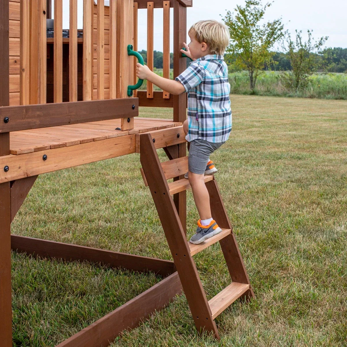 Backyard Discovery Echo Heights Cedar Wooden Elevated Kids Playhouse with Wave Slide, Play Kitchen, and Deck